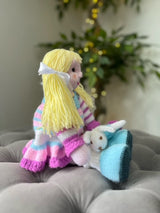 Hand Made Knitted Girl Doll with Blonde Hair Holding a Bunny Toy Oh So Crafty